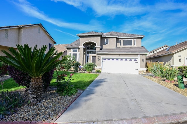 738 Century Ln, Clovis, CA 93612 - view of front of property featuring a garage, stucco siding, concrete driveway, and a front lawn
