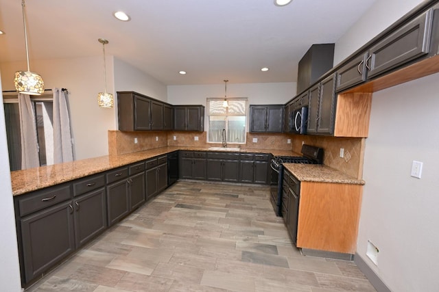 738 Century Ln, Clovis, CA 93612 - kitchen with a sink, light stone countertops, recessed lighting, and stainless steel appliances