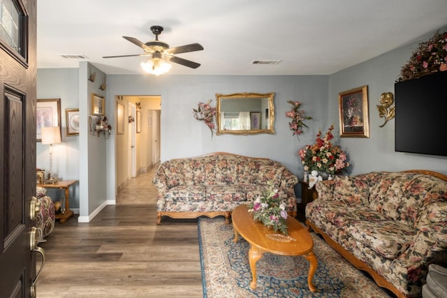 607 N 4th St, Fresno, CA 93702 - living room with ceiling fan, wood finished floors, and visible vents