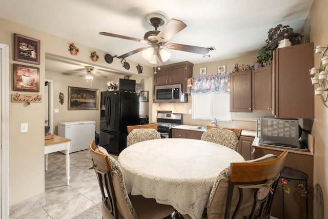 607 N 4th St, Fresno, CA 93702 - dining area featuring a ceiling fan and light tile patterned floors