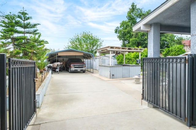 607 N 4th St, Fresno, CA 93702 - exterior space featuring fence, a shed, a gate, a carport, and driveway