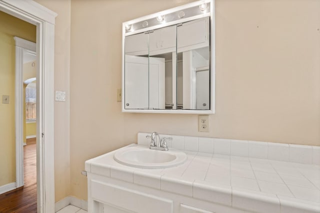 811 E Cambridge Ave, Fresno, CA 93704 - bathroom featuring baseboards and vanity