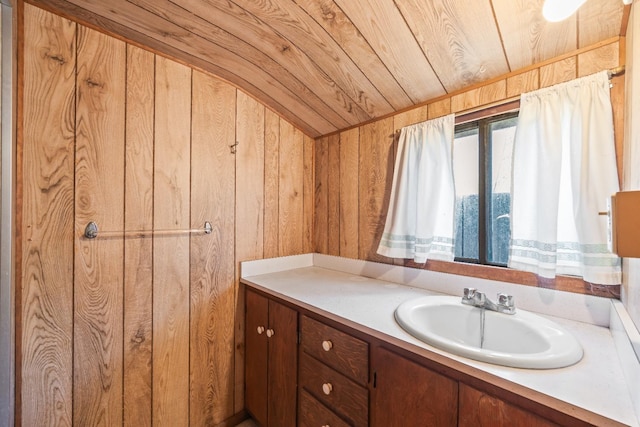 811 E Cambridge Ave, Fresno, CA 93704 - bathroom with wood ceiling, wooden walls, and vanity