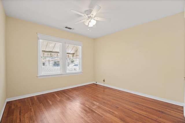 811 E Cambridge Ave, Fresno, CA 93704 - empty room featuring baseboards, wood finished floors, and a ceiling fan