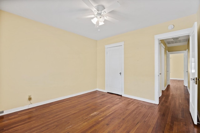 811 E Cambridge Ave, Fresno, CA 93704 - unfurnished bedroom featuring baseboards, dark wood-style floors, a closet, and ceiling fan
