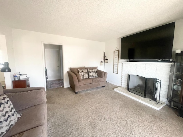 living room featuring a fireplace, carpet, and a textured ceiling