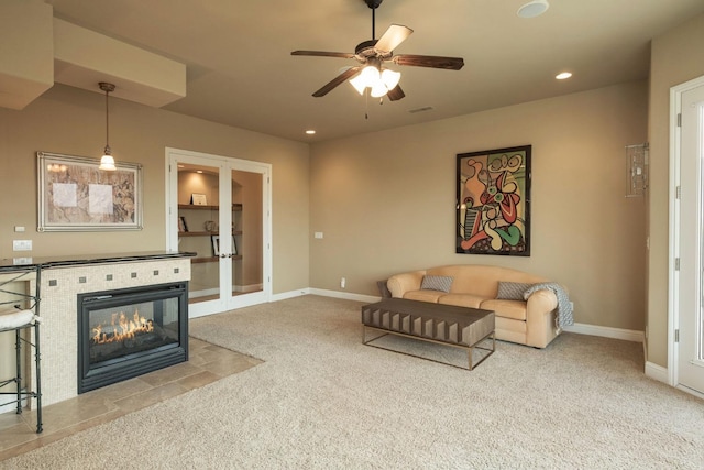 living area with recessed lighting, ceiling fan, french doors, and carpet