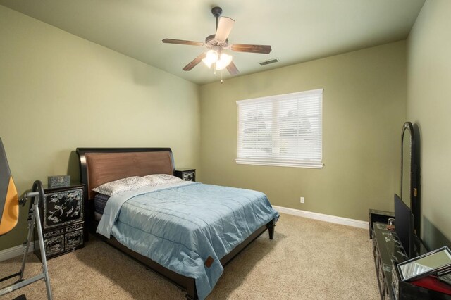bedroom with visible vents, a ceiling fan, carpet, and baseboards