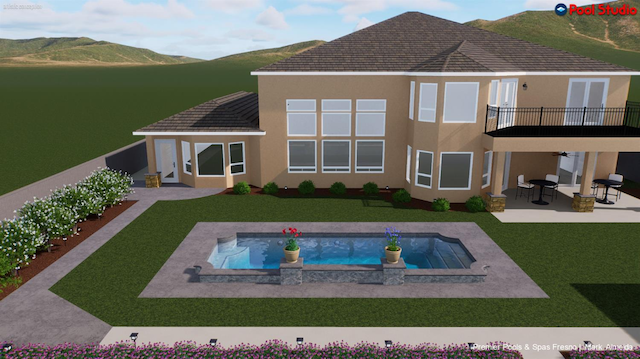 5136 W Bluff Ave, Fresno, CA 93722 - back of property with a balcony, a patio area, an in-ground hot tub, stucco siding, and a lawn