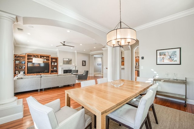 8389 N Paula Ave, Fresno, CA 93720 - dining room with decorative columns, arched walkways, ceiling fan with notable chandelier, and recessed lighting