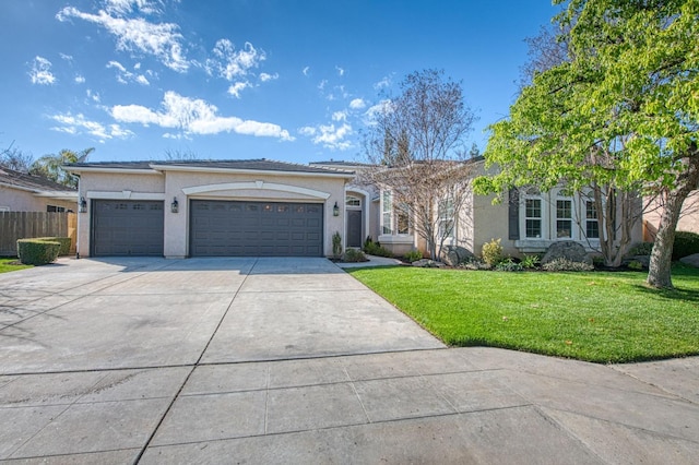 8389 N Paula Ave, Fresno, CA 93720 - single story home with stucco siding, a front yard, fence, an attached garage, and concrete driveway