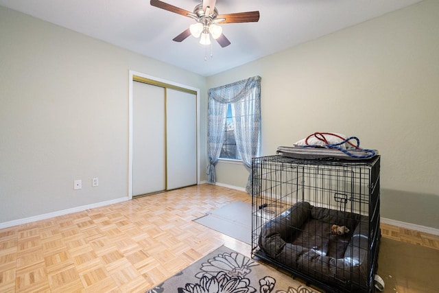 bedroom featuring a closet, ceiling fan, and baseboards