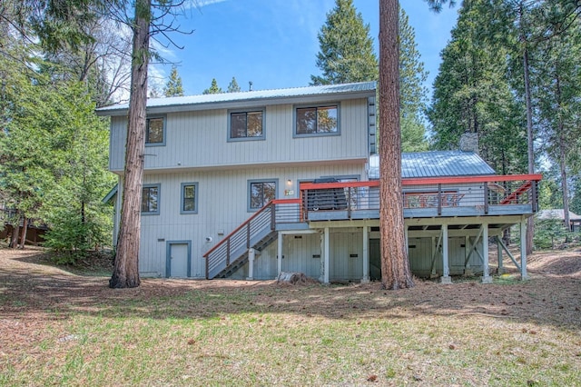 41811 Gray Rock Rd, Shaver Lake, CA 93664 - rear view of house featuring stairway, metal roof, a wooden deck, and a lawn