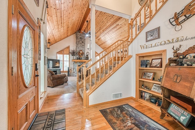 41811 Gray Rock Rd, Shaver Lake, CA 93664 - entryway featuring visible vents, hardwood / wood-style flooring, beamed ceiling, stairway, and high vaulted ceiling