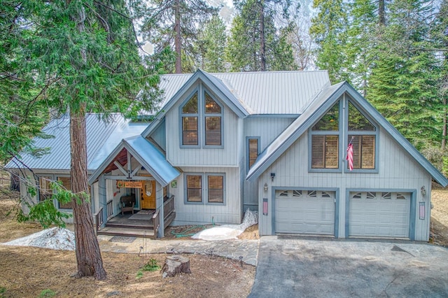 41811 Gray Rock Rd, Shaver Lake, CA 93664 - view of front facade with aphalt driveway, a porch, and metal roof