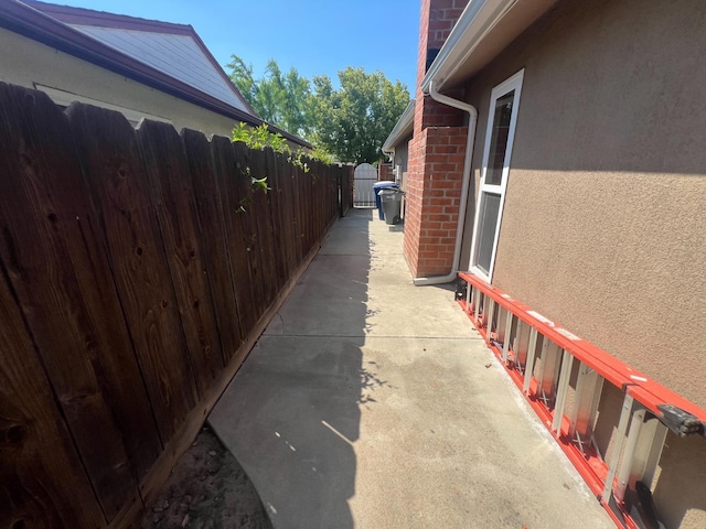 1450 W Chennault Ave, Fresno, CA 93711 - view of property exterior featuring fence, brick siding, and stucco siding