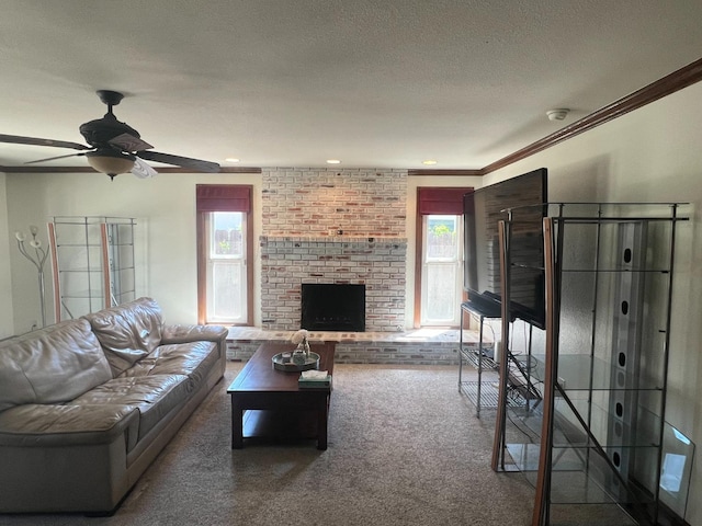 1450 W Chennault Ave, Fresno, CA 93711 - living area featuring a textured ceiling, ceiling fan, a fireplace, ornamental molding, and carpet flooring