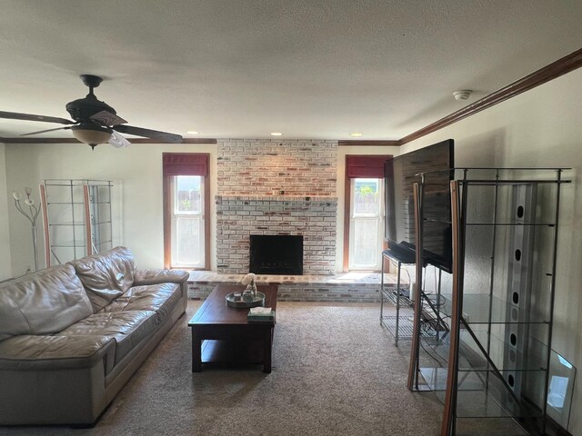 1450 W Chennault Ave, Fresno, CA 93711 - carpeted living room featuring a fireplace, a ceiling fan, ornamental molding, and a textured ceiling