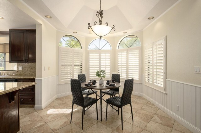 10001 N Pheasant Run Dr, Fresno, CA 93730 - dining space with plenty of natural light, a wainscoted wall, recessed lighting, and light tile patterned floors