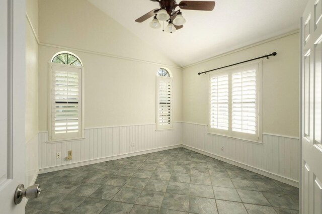 10001 N Pheasant Run Dr, Fresno, CA 93730 - spare room with wainscoting, ceiling fan, plenty of natural light, and lofted ceiling