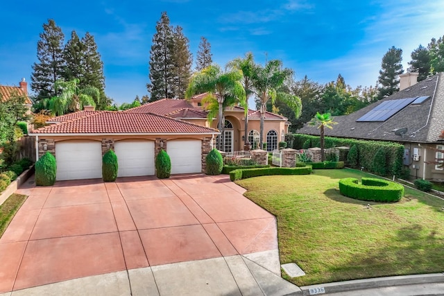 9336 N St Martin Dr, Fresno, CA 93720 - mediterranean / spanish house featuring a tile roof, concrete driveway, a front yard, a garage, and stucco siding