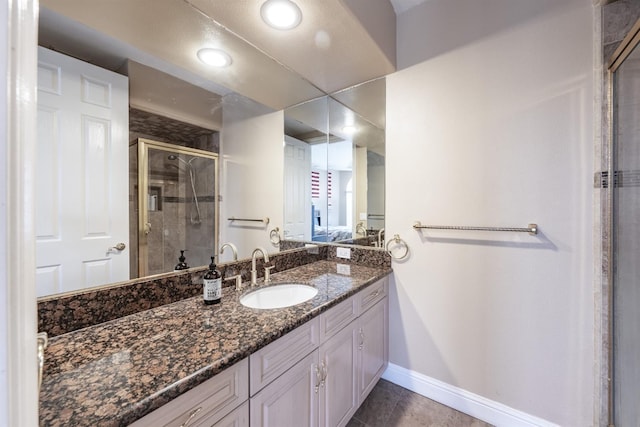 9336 N St Martin Dr, Fresno, CA 93720 - full bathroom featuring vanity, baseboards, tile patterned flooring, and a shower stall