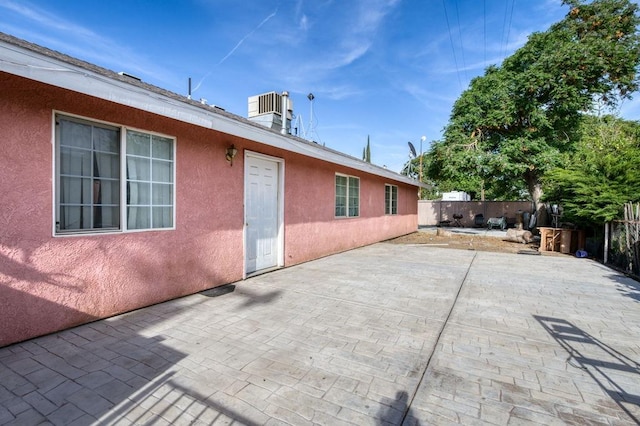 view of patio / terrace with a fenced backyard and central AC unit
