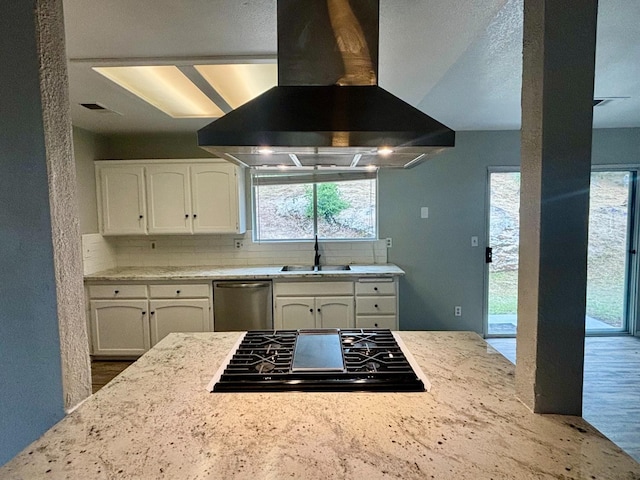 28813 Limestone Cir, Coarsegold, CA 93614 - kitchen featuring island range hood, black stovetop, stainless steel dishwasher, white cabinets, and backsplash