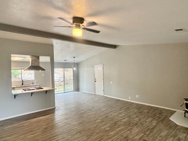 28813 Limestone Cir, Coarsegold, CA 93614 - unfurnished living room with dark wood-style floors, a ceiling fan, a textured ceiling, baseboards, and a sink