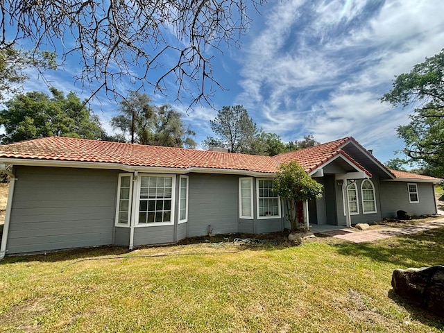 28813 Limestone Cir, Coarsegold, CA 93614 - back of property featuring a tile roof and a yard