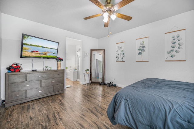 bedroom with connected bathroom, baseboards, a ceiling fan, and dark wood-style floors