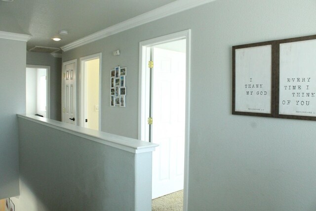 5148 W Pine Ave, Fresno, CA 93722 - hallway featuring ornamental molding, carpet flooring, and an upstairs landing