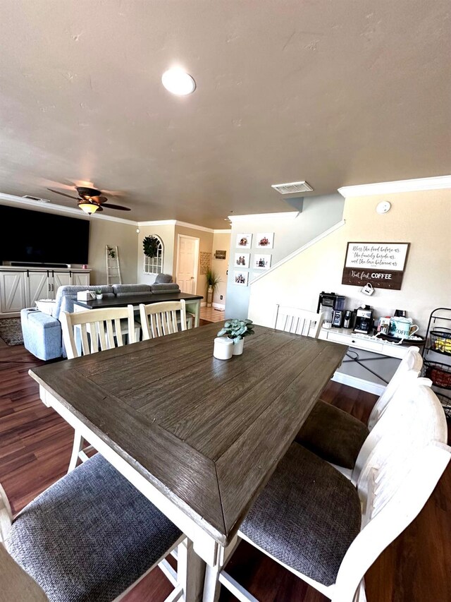 5148 W Pine Ave, Fresno, CA 93722 - dining room featuring a ceiling fan, wood finished floors, and visible vents