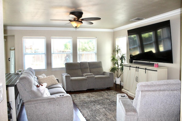 5148 W Pine Ave, Fresno, CA 93722 - living room featuring ornamental molding, dark wood finished floors, a ceiling fan, and visible vents