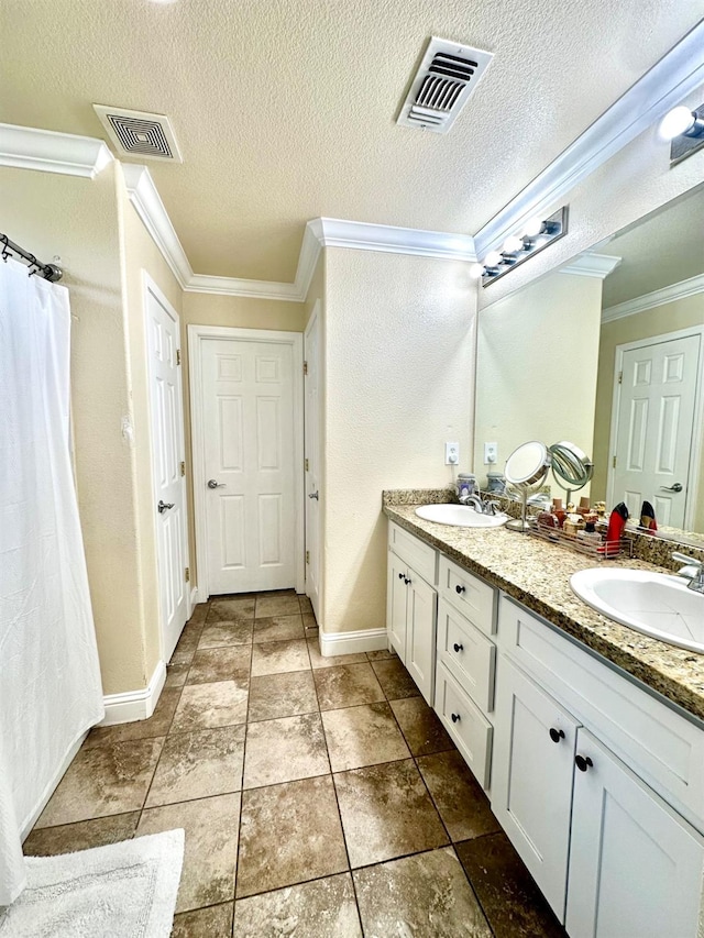 5148 W Pine Ave, Fresno, CA 93722 - full bath with ornamental molding, a sink, and visible vents