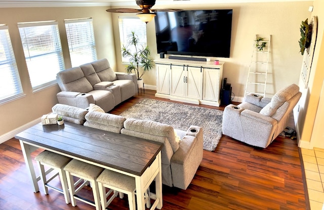 5148 W Pine Ave, Fresno, CA 93722 - living room featuring baseboards, ornamental molding, ceiling fan, and dark wood-style flooring