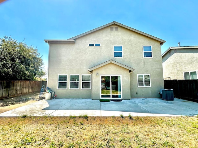 5148 W Pine Ave, Fresno, CA 93722 - back of house with a fenced backyard, central AC, a patio, and stucco siding