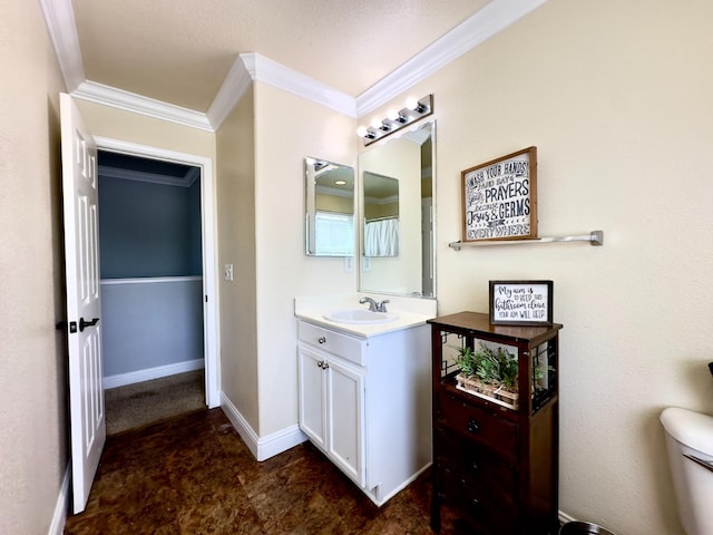 5148 W Pine Ave, Fresno, CA 93722 - bathroom featuring baseboards, vanity, ornamental molding, and toilet