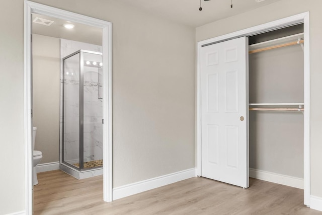 3659 Mono St, Fresno, CA 93702 - unfurnished bedroom featuring wood finished floors, a closet, and ensuite bathroom
