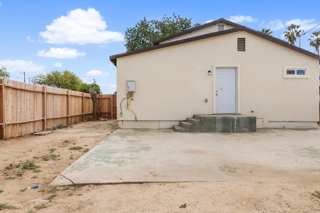 3659 Mono St, Fresno, CA 93702 - rear view of property with stucco siding and a patio area