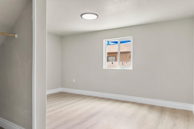 3659 Mono St, Fresno, CA 93702 - spare room featuring light wood-style floors and baseboards