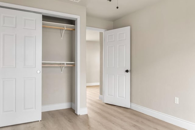 3659 Mono St, Fresno, CA 93702 - unfurnished bedroom featuring a closet and wood finished floors