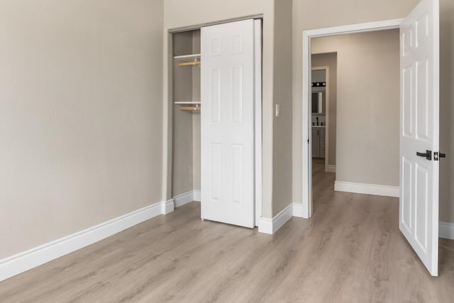 3659 Mono St, Fresno, CA 93702 - unfurnished bedroom with light wood finished floors and a closet