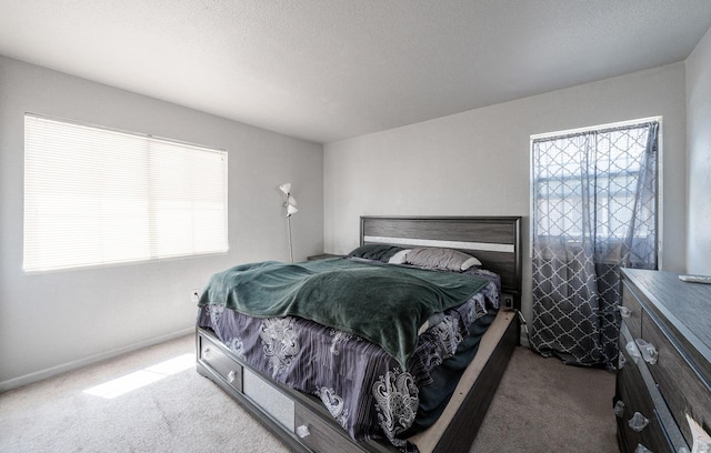 bedroom with carpet and baseboards