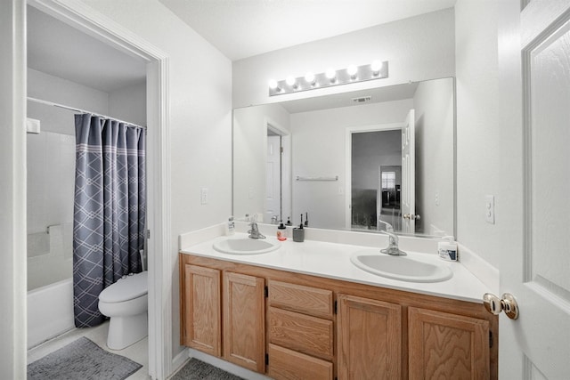 full bath featuring shower / tub combo, toilet, a sink, and double vanity
