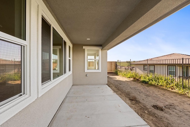 view of patio / terrace featuring fence