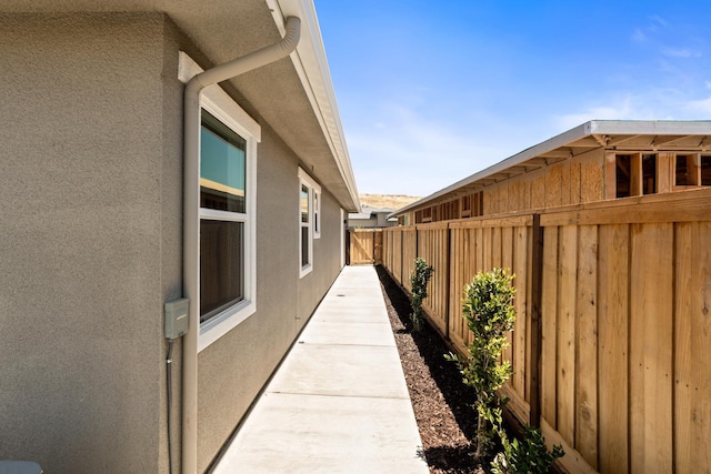 8184 Creek Vw, Friant, CA 93626 - view of side of home featuring stucco siding