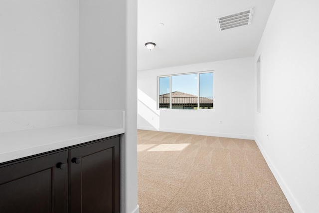 interior space with baseboards and visible vents