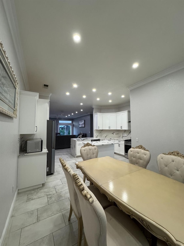 5357 E Burns, Fresno, CA 93725 - dining area featuring recessed lighting and crown molding