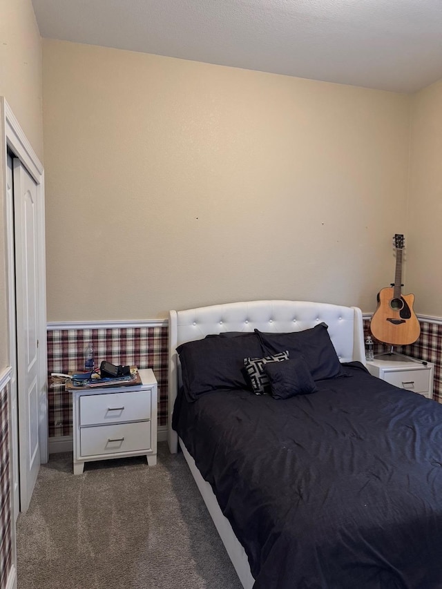 5357 E Burns, Fresno, CA 93725 - bedroom with wallpapered walls, a closet, carpet flooring, and a wainscoted wall